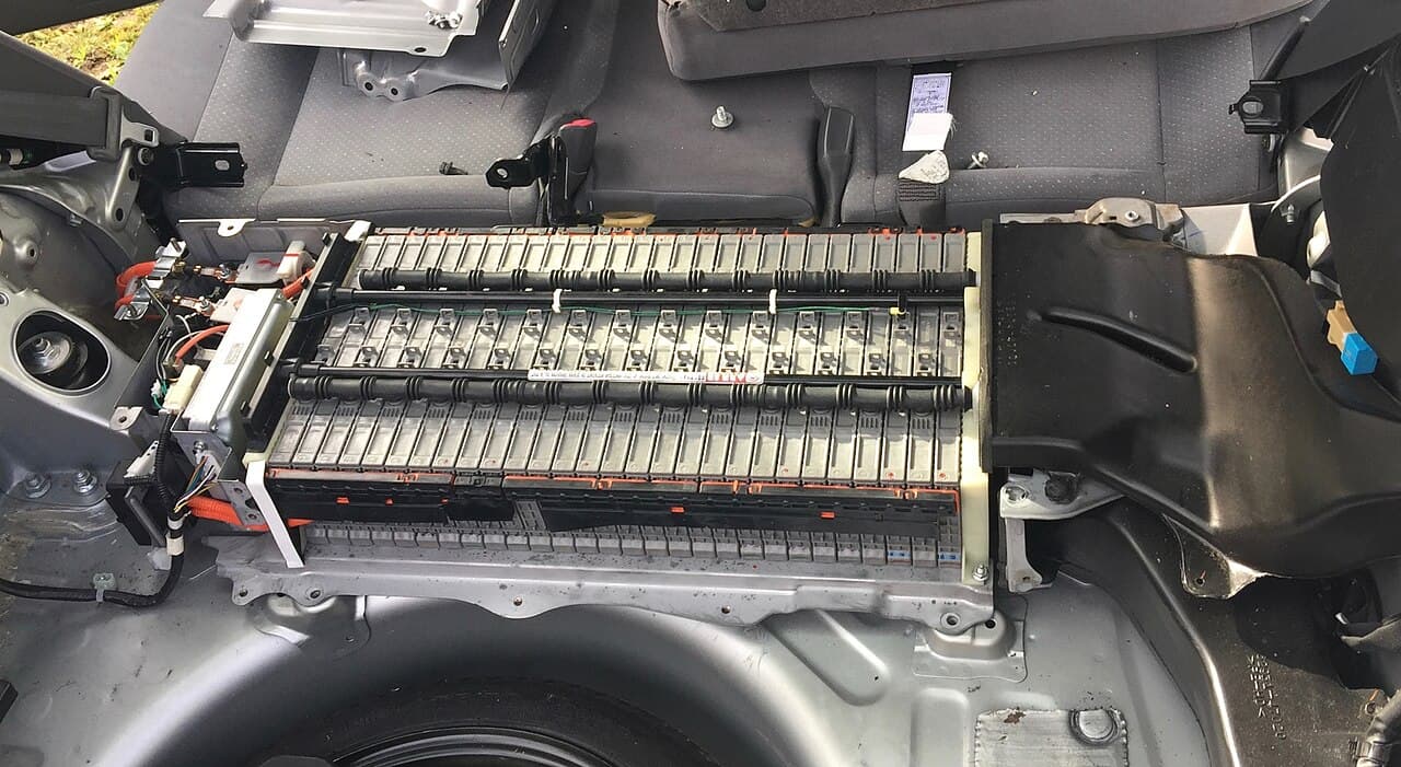 Toyota Prius high-voltage hybrid battery pack with modules and orange HV cables